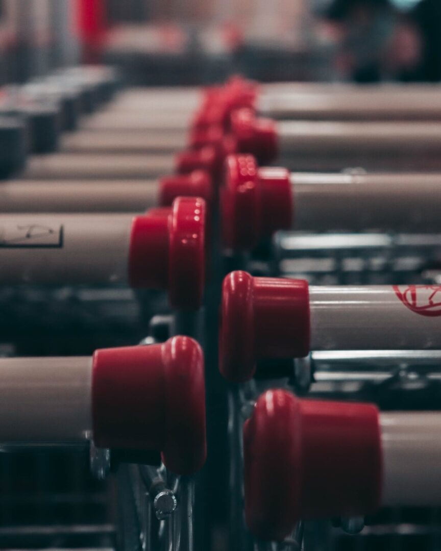 A row of red and white bottles lined up.